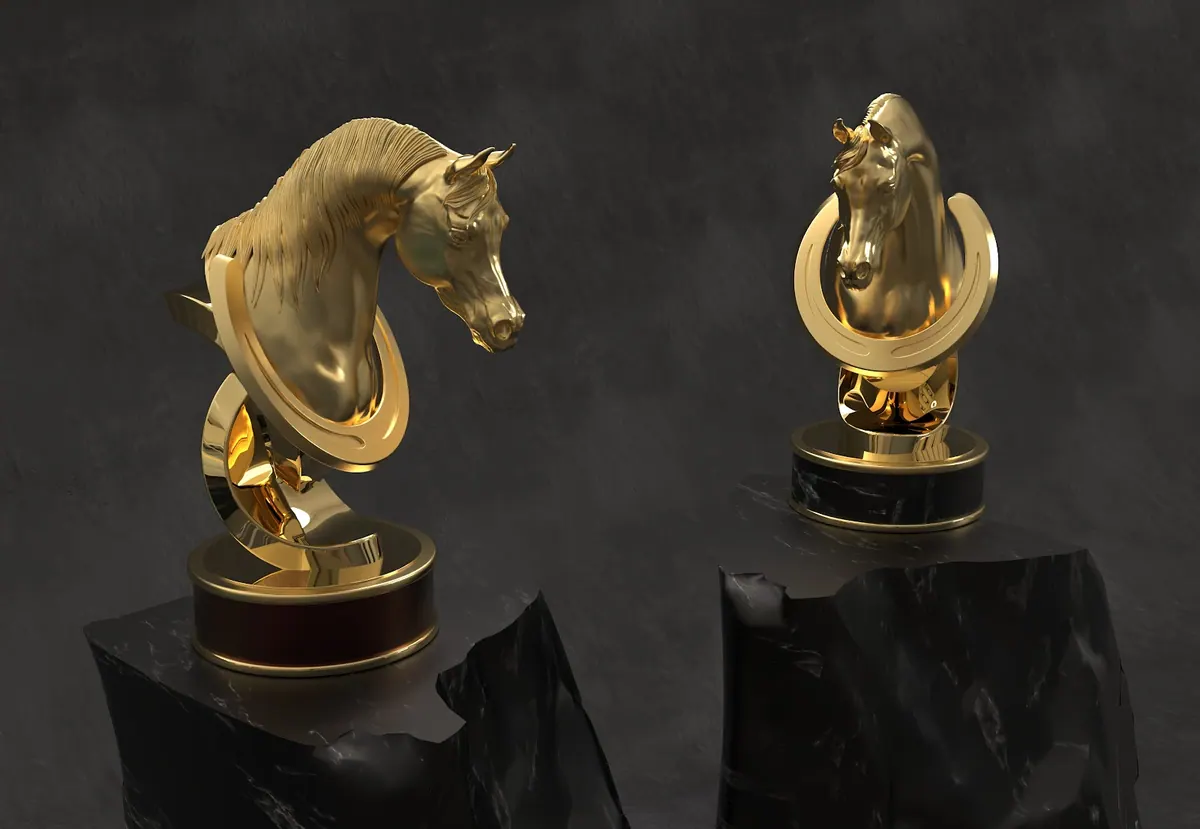 Two gold horse-head trophies on black presentation bases