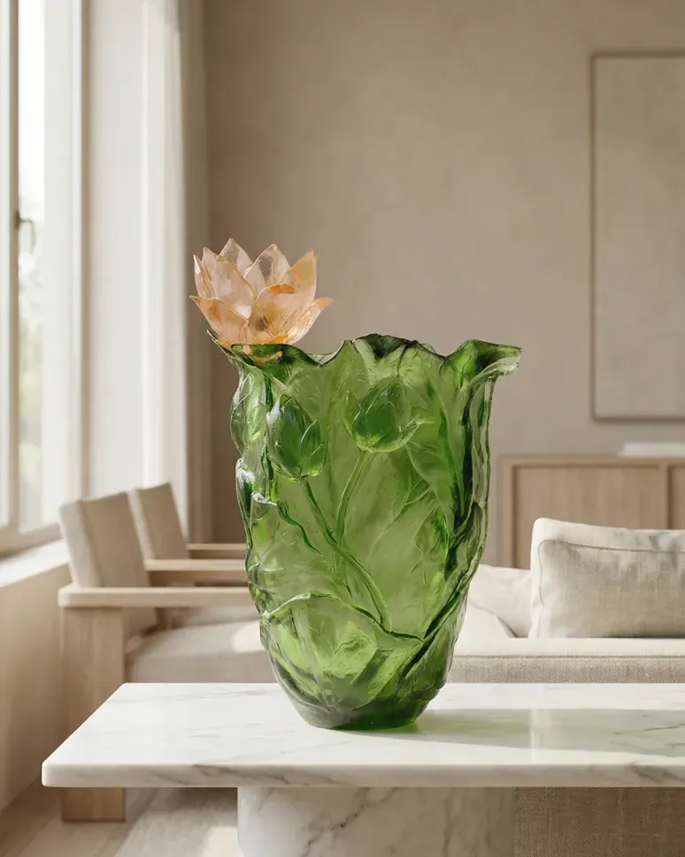 Green crystal vase with sculpted leaf surface and a lotus bloom